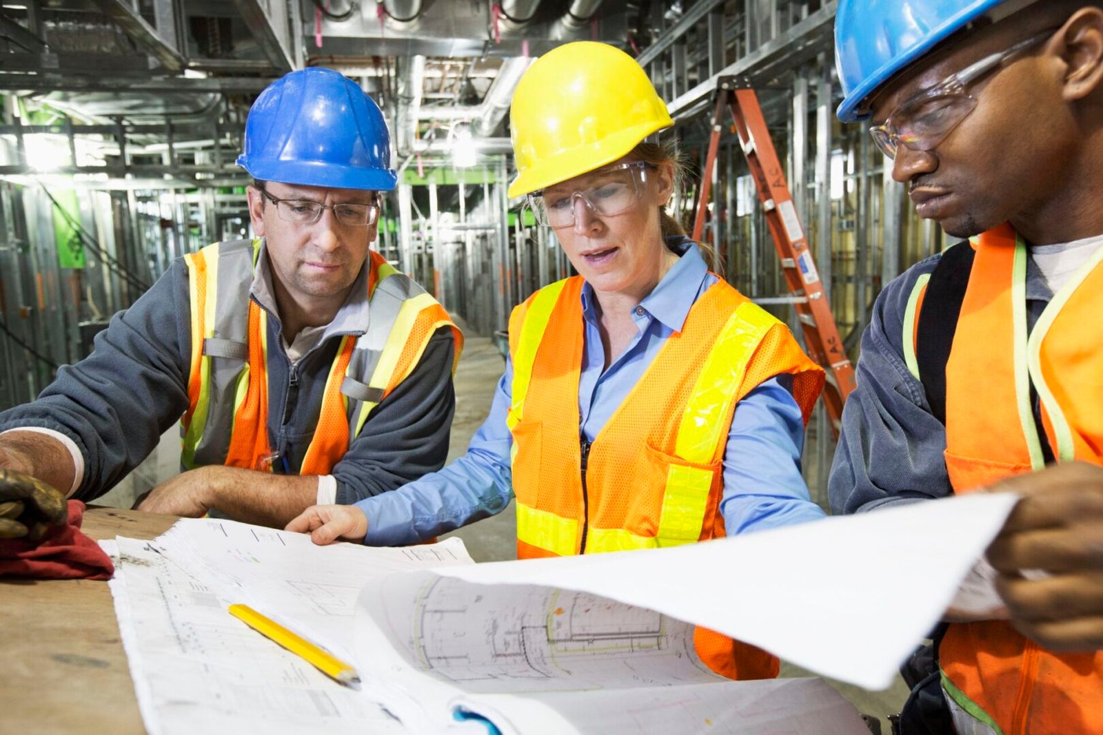 workers-reading-blueprints-on-site-181215658-59eaadfb0d327a0010c48180-1-scaled